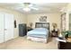 Bright bedroom with ceiling fan, carpet floors, neutral walls and good natural light at 66 John Stuart Mill St, Henderson, NV 89002