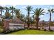 Inviting Palm Hills community entrance with lush landscaping and swaying palm trees offering a warm welcome at 66 John Stuart Mill St, Henderson, NV 89002