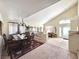 Bright dining room featuring a large table with seating for six, plush carpeting, and stylish decor at 66 John Stuart Mill St, Henderson, NV 89002