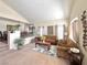 Inviting living room featuring plush carpeting, comfortable seating, and stylish decor, perfect for relaxation at 66 John Stuart Mill St, Henderson, NV 89002