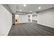 Large basement area with recessed lighting and neutral carpet, featuring doorways to other spaces at 7060 W Rome Blvd, Las Vegas, NV 89131