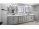 Bathroom with a modern vanity, dual sinks, and stylish lighting at 7060 W Rome Blvd, Las Vegas, NV 89131