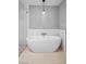 Modern bathroom featuring a standalone tub and stylish pendant lighting at 7060 W Rome Blvd, Las Vegas, NV 89131