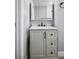 Bathroom with a vanity featuring a marble countertop, undermount sink and black hardware at 7060 W Rome Blvd, Las Vegas, NV 89131
