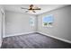Neutral bedroom with plush carpeting, natural light, and a ceiling fan at 7060 W Rome Blvd, Las Vegas, NV 89131