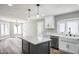 This kitchen features stone countertops, stainless steel appliances, and an island at 7060 W Rome Blvd, Las Vegas, NV 89131