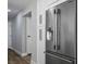 The kitchen includes a stainless steel fridge, white cabinets, and hard floors at 7060 W Rome Blvd, Las Vegas, NV 89131
