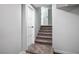 Carpeted stairs leading to another level, next to a door, providing easy access between floors at 7060 W Rome Blvd, Las Vegas, NV 89131