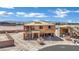 Two-story home under construction featuring a wooden frame and mountain views, with a dumpster nearby at 7121 Painted Skyline St, Las Vegas, NV 89118