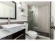 Modern bathroom with glass shower, vessel sink, decorative tile, and sleek fixtures at 7384 Valhalla Ln, Las Vegas, NV 89123