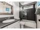 A clean bathroom featuring a tiled shower, vanity sink, and toilet at 7384 Valhalla Ln, Las Vegas, NV 89123