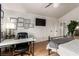 Bright bedroom with a workstation, neutral decor, and updated light fixture at 7384 Valhalla Ln, Las Vegas, NV 89123