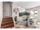 Bright dining area adjacent to the stairs with a view of the outdoor pool at 7384 Valhalla Ln, Las Vegas, NV 89123