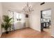 Chic dining room with modern lighting fixture and beautiful hardwood floors at 7384 Valhalla Ln, Las Vegas, NV 89123