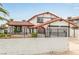 Charming two-story home featuring a well-maintained lawn and Spanish style roof at 7384 Valhalla Ln, Las Vegas, NV 89123