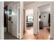 Hallway between bathroom and two bedrooms with hardwood floors at 7384 Valhalla Ln, Las Vegas, NV 89123