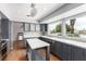 Bright kitchen showcasing stainless steel appliances, quartz countertops, and ample cabinet space at 7384 Valhalla Ln, Las Vegas, NV 89123