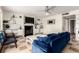 Cozy living room with a fireplace, stylish decor, and comfortable seating at 7384 Valhalla Ln, Las Vegas, NV 89123