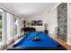 Bright and modern billiard room with a piano, hardwood floors and sheer curtains at 7384 Valhalla Ln, Las Vegas, NV 89123