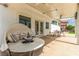 Outdoor patio featuring a round daybed and a dining table at 7384 Valhalla Ln, Las Vegas, NV 89123