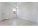 Bright living room with tile floors, a decorative wall, and modern lighting at 756 Sleeping City Ave, Henderson, NV 89015