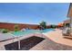 Large backyard featuring pool, ping pong table, and outdoor seating perfect for gatherings at 7590 Rancho Destino Rd, Las Vegas, NV 89123