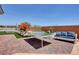 Spacious backyard with a ping pong table, seating, and artificial turf for year-round enjoyment at 7590 Rancho Destino Rd, Las Vegas, NV 89123