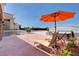 Backyard patio with a hot tub and seating, ideal for relaxation and entertainment at 7590 Rancho Destino Rd, Las Vegas, NV 89123