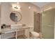 Updated bathroom featuring a shower, toilet, and floating vanity sink with granite countertop at 7590 Rancho Destino Rd, Las Vegas, NV 89123