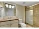 Bathroom with marble countertop vanity and step-in shower with marble tiling at 7590 Rancho Destino Rd, Las Vegas, NV 89123