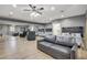 Spacious bedroom with multiple beds, seating, and a mirrored wall, offering flexibility at 7590 Rancho Destino Rd, Las Vegas, NV 89123
