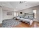 Spacious bedroom featuring two queen beds, hardwood floors, and a gray patterned rug at 7590 Rancho Destino Rd, Las Vegas, NV 89123