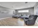 Large bedroom with hardwood floors, two beds, and a recliner at 7590 Rancho Destino Rd, Las Vegas, NV 89123