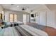 Spacious bedroom featuring two queen beds, hardwood floors, and a patio view at 7590 Rancho Destino Rd, Las Vegas, NV 89123