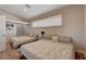 Comfortable bedroom with two beds and soft, neutral bedding for a relaxing ambiance at 7590 Rancho Destino Rd, Las Vegas, NV 89123