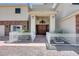 Grand entryway with a statement chandelier, decorative stone accents, and a welcoming pathway at 7590 Rancho Destino Rd, Las Vegas, NV 89123