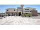 Elegant stucco home featuring stone accents, double-door entryway, and desert landscaping at 7590 Rancho Destino Rd, Las Vegas, NV 89123