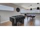 Entertain in this game room with a foosball and pool table, clock and views at 7590 Rancho Destino Rd, Las Vegas, NV 89123