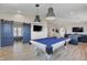 Entertain in this spacious game room with a pool table and easy access to other rooms at 7590 Rancho Destino Rd, Las Vegas, NV 89123