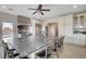 Gourmet kitchen boasts a large island, stainless steel appliances, and an industrial-style vent hood at 7590 Rancho Destino Rd, Las Vegas, NV 89123