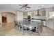Bright eat-in kitchen showcases a large island with seating, stainless steel appliances, and custom cabinets at 7590 Rancho Destino Rd, Las Vegas, NV 89123