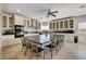 Spacious kitchen features a large island with seating, stainless steel appliances, and custom cabinetry at 7590 Rancho Destino Rd, Las Vegas, NV 89123