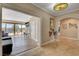 Bright living space with direct access to a pool via sliding glass doors, creating an indoor-outdoor flow at 7590 Rancho Destino Rd, Las Vegas, NV 89123
