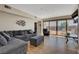 Inviting living room with comfortable seating and a view of the outdoor pool and patio area at 7590 Rancho Destino Rd, Las Vegas, NV 89123