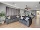 Inviting living room with hardwood floors, comfortable seating, and neutral color scheme at 7590 Rancho Destino Rd, Las Vegas, NV 89123
