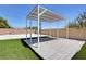 Backyard pergola sits on faux lawn next to a full basketball court at 7590 Rancho Destino Rd, Las Vegas, NV 89123