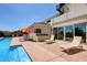 Inviting backyard pool with sun loungers for relaxing and entertaining on a sunny day at 7590 Rancho Destino Rd, Las Vegas, NV 89123