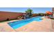 Beautiful backyard pool featuring a rock waterfall and plenty of space for enjoying outdoor living at 7590 Rancho Destino Rd, Las Vegas, NV 89123