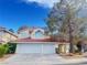 Charming two-story home featuring a two-car garage and tile roof in a quiet neighborhood at 7641 Tortola Bay Ln, Las Vegas, NV 89128