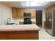 Functional kitchen features stainless steel appliances and ample counter space at 7641 Tortola Bay Ln, Las Vegas, NV 89128